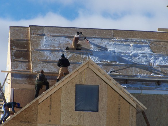 removing snow from vermont timber frame home