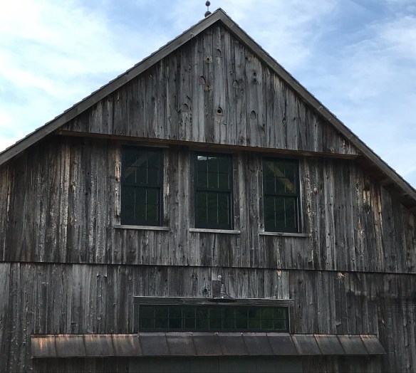 timber frame barn with barn swallows