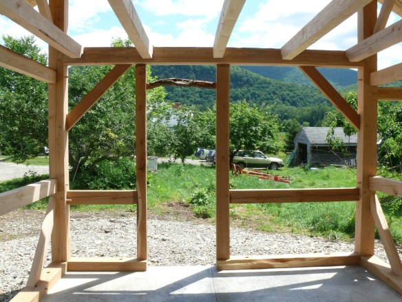 Plumb tree door header in timber frame sugar house green mountain timber frames