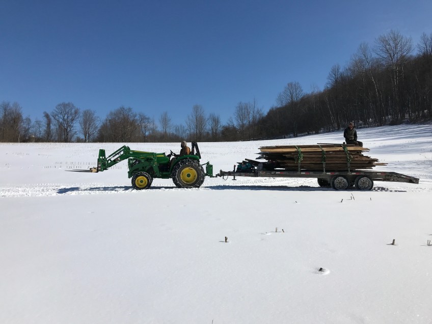 trapper cabin corn crib hauled through the fields for restoration green mountain timber frames
