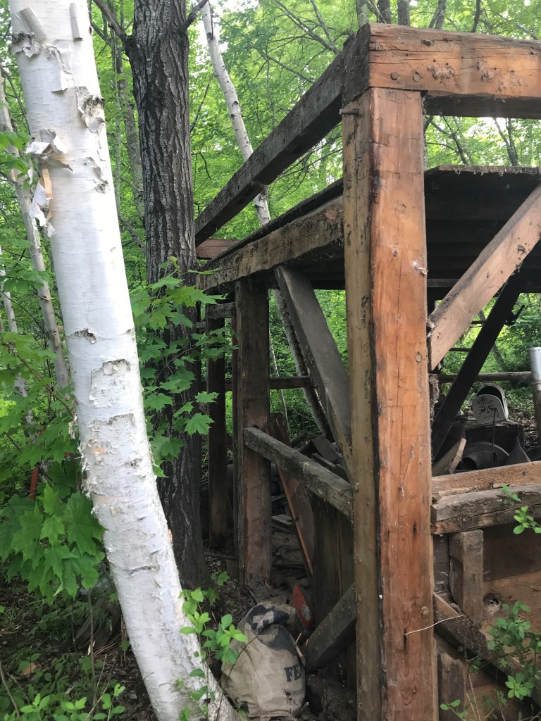 waterford corn crib tucked into the woods - green mountain timber frames