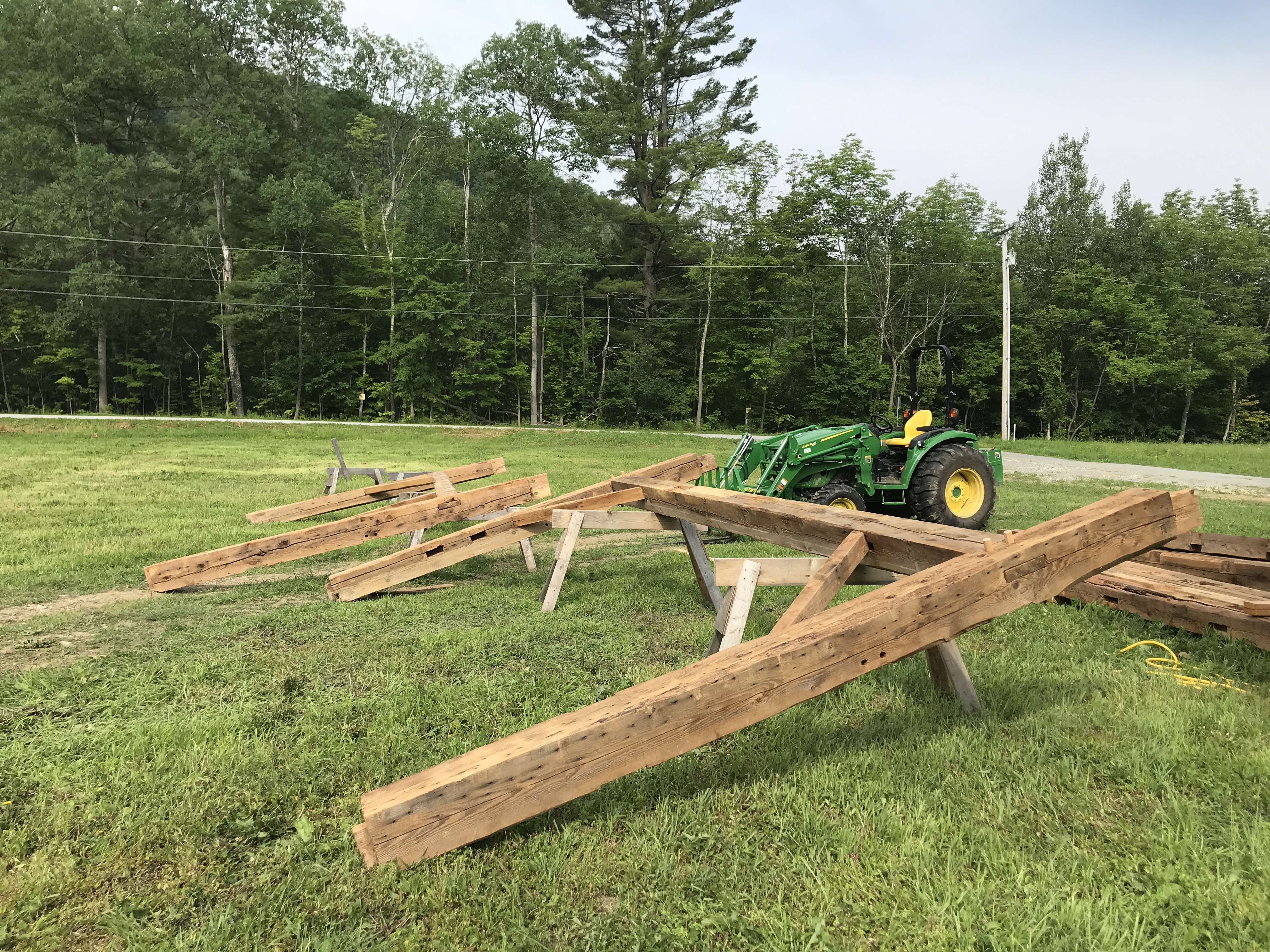 raising reclaimed wood from timber frame barn home in Vermont
